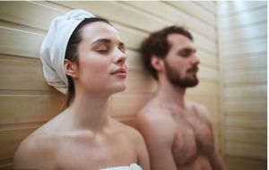 a man and a woman are having a rest after taking a sauna shower