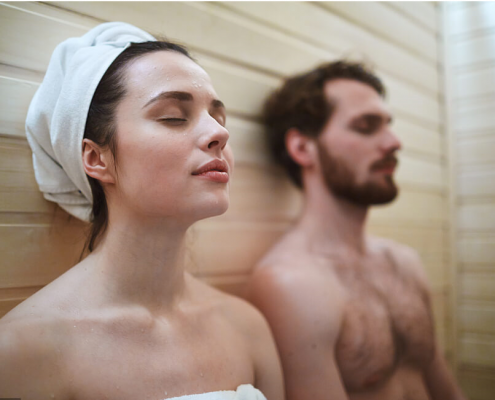 a man and a woman are having a rest after taking a sauna shower